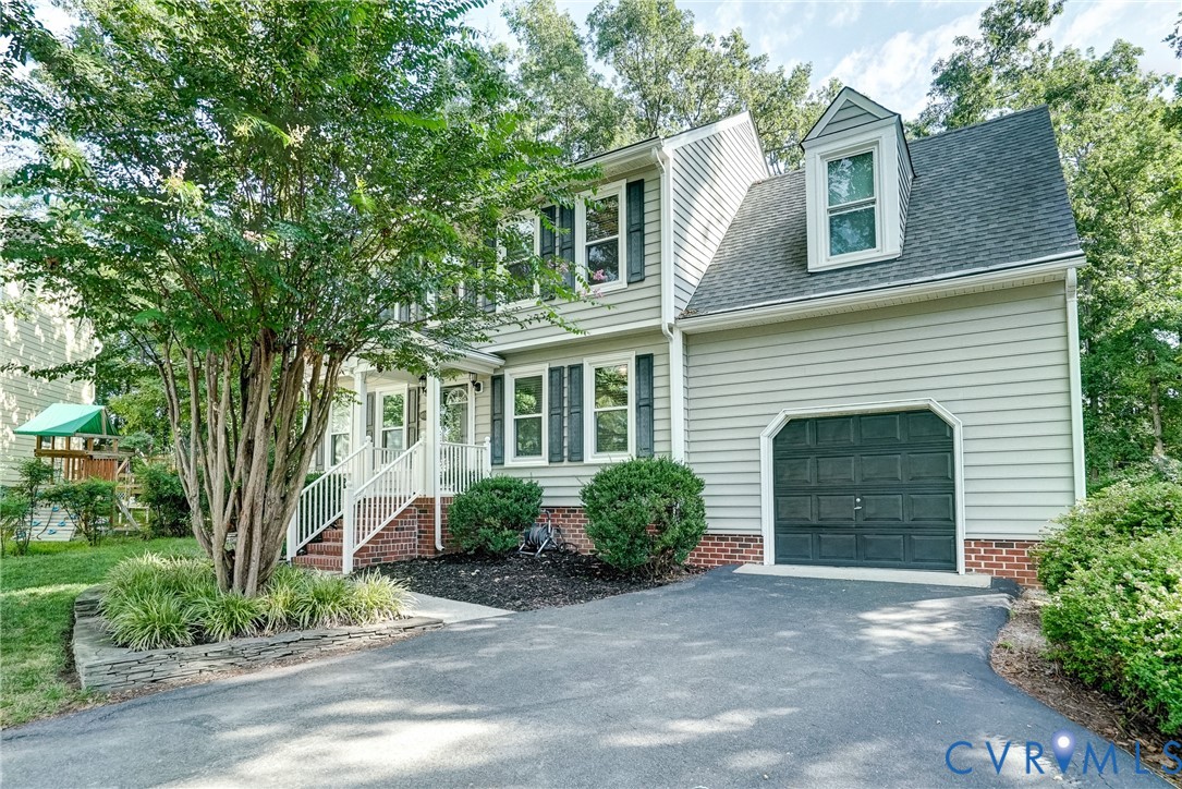 Another front view.  Low maintenance vinyl siding and newer windows.  Space above garage can be finished for additional living space!