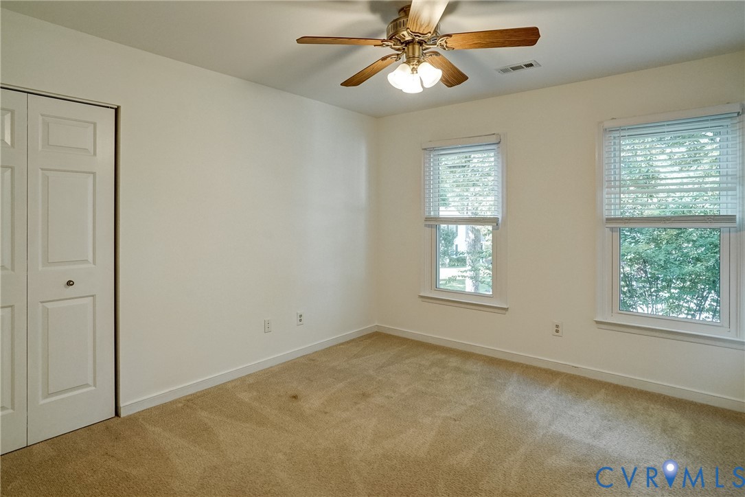 Freshly painted Bedroom #2 has ceiling fan with light and nice size closet