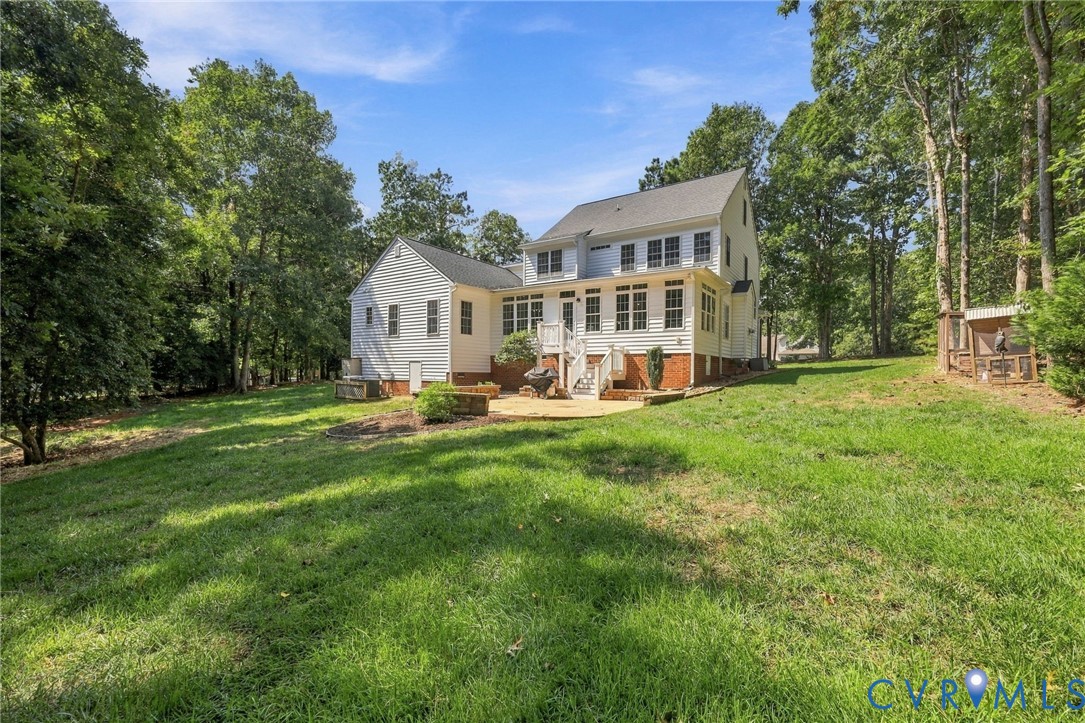 Expansive lawn bordered by mature trees