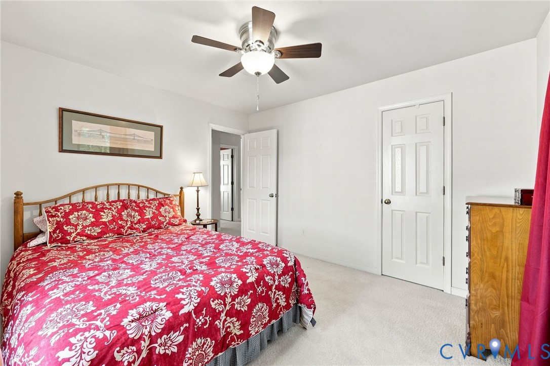 Light-toned carpeting and white walls