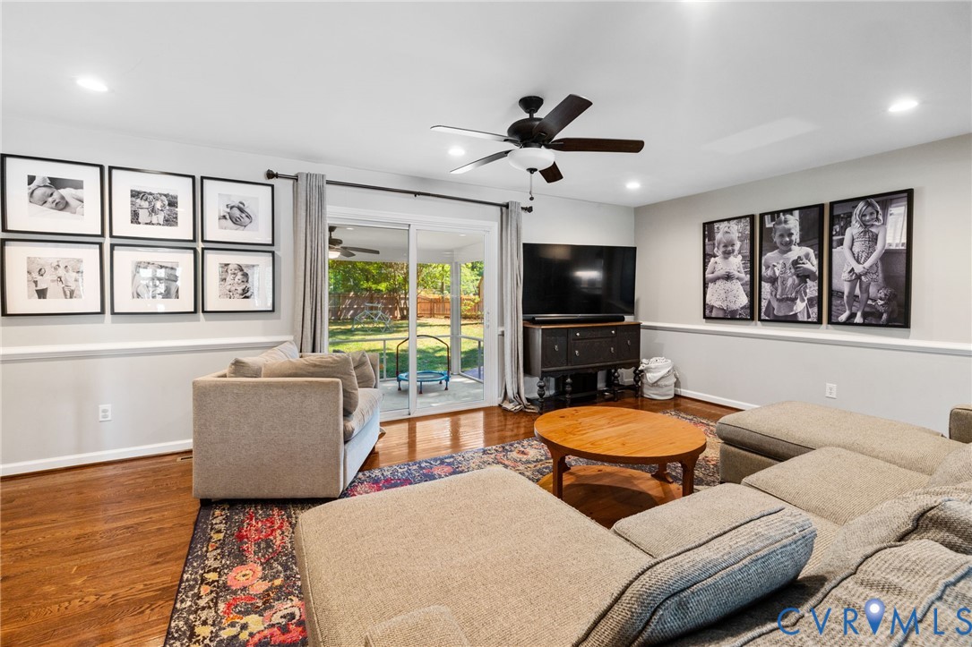 Hardwood flooring, recessed lighting, and a ceiling fan with light fixture