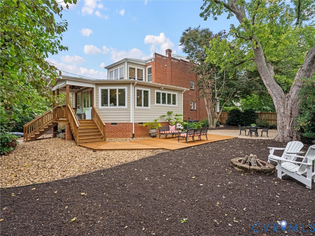 Expansive side yard with mature landscaping, sprinklers and hardscaping. Even an outdoor shower!