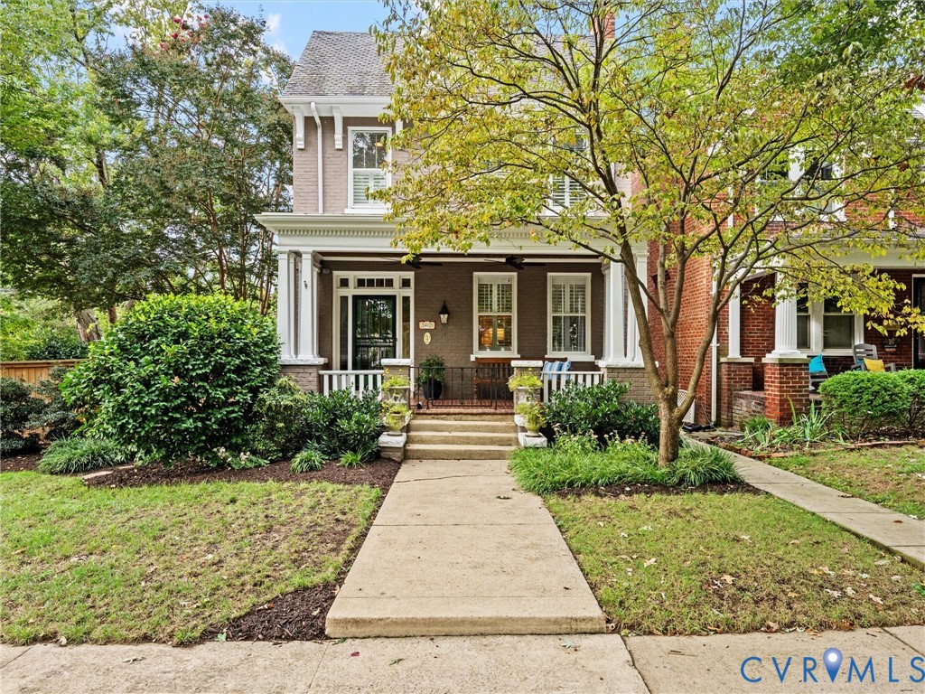 Brick & slate with expansive front porch & side yard