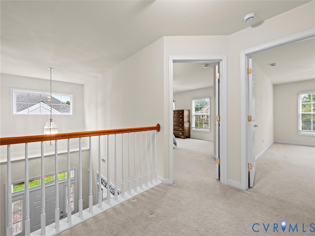 Upstairs landing overlooking foyer.,