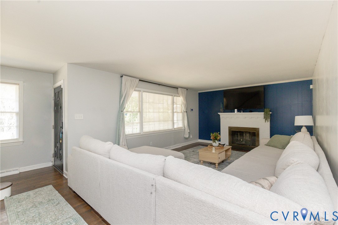 Spacious w//large pictur4e window, gas fireplace and wood floors!