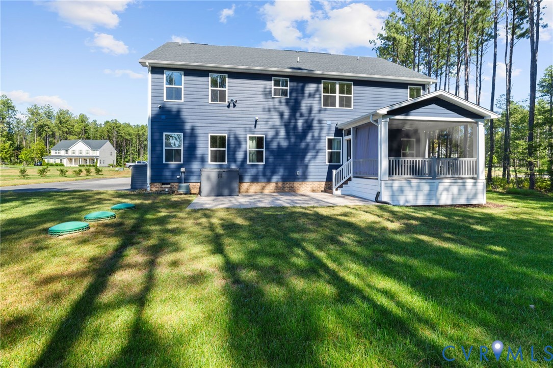 Blue siding exterior with a screened porch and white railings