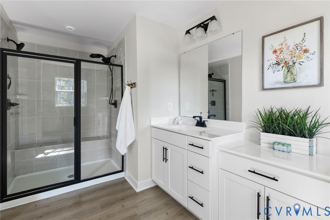 Glass-enclosed shower with a tiled surround and built-in bench