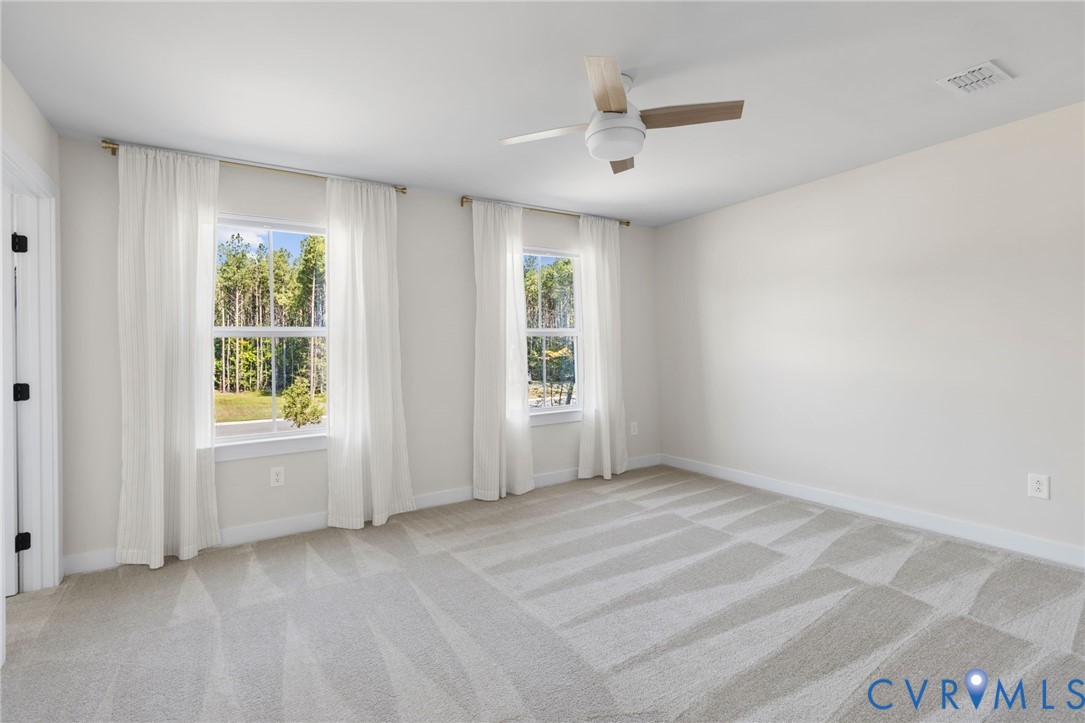 Neutral-toned carpeting throughout