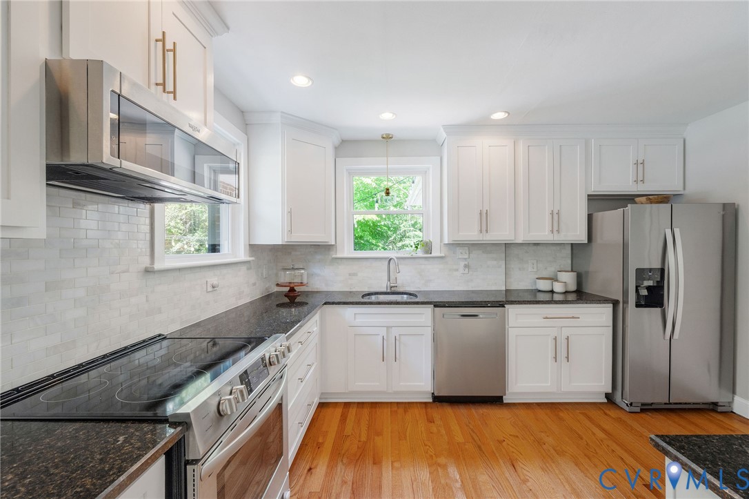 New wood floors extended into kitchen