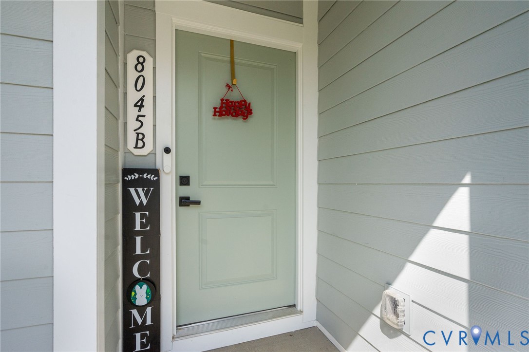 Light-toned horizontal siding with a contrasting white trim