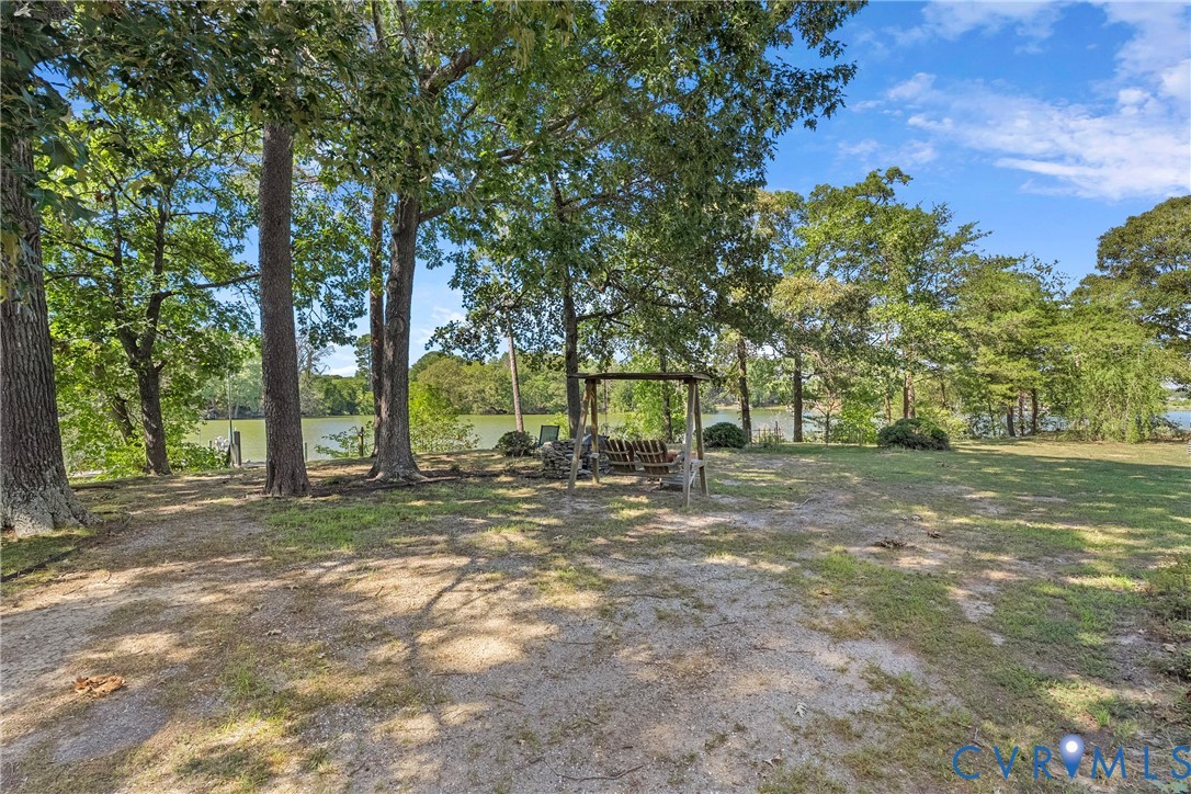 Expansive grounds with mature trees and waterfront access