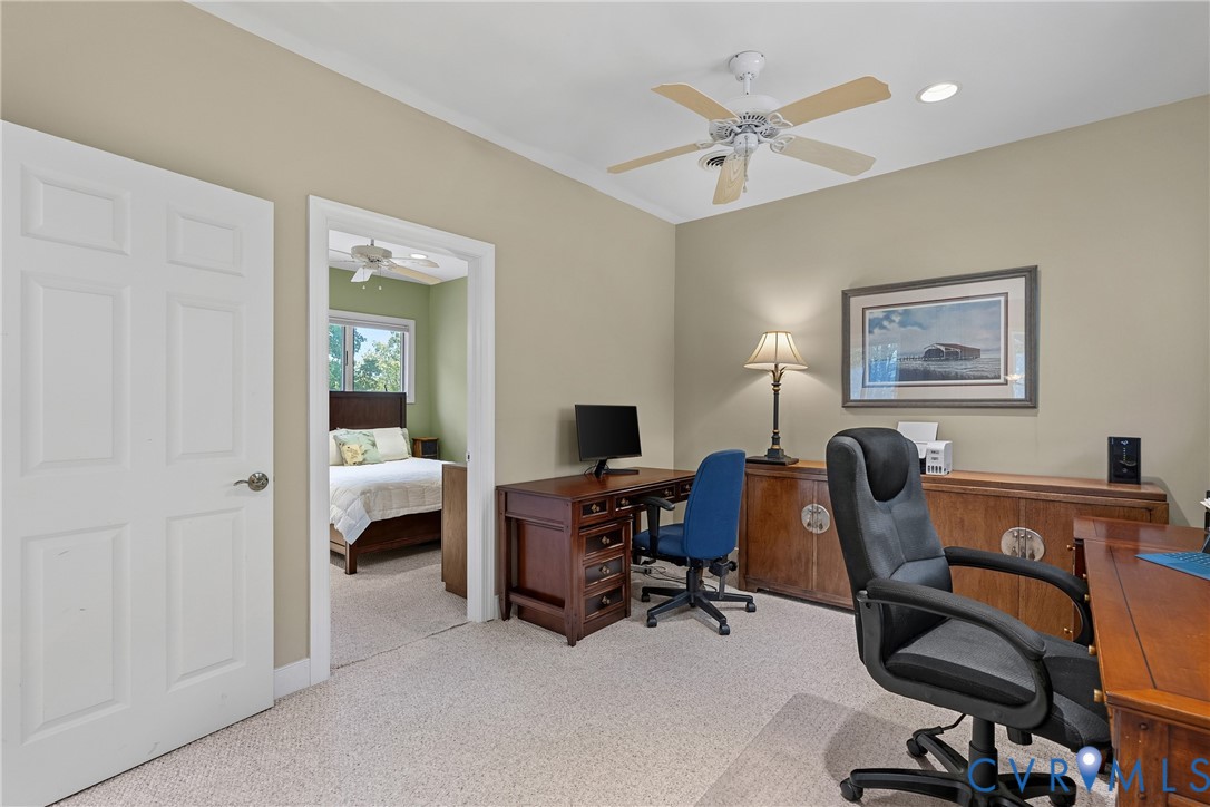Recessed lighting, ceiling fan with light, crown molding, and carpet flooring