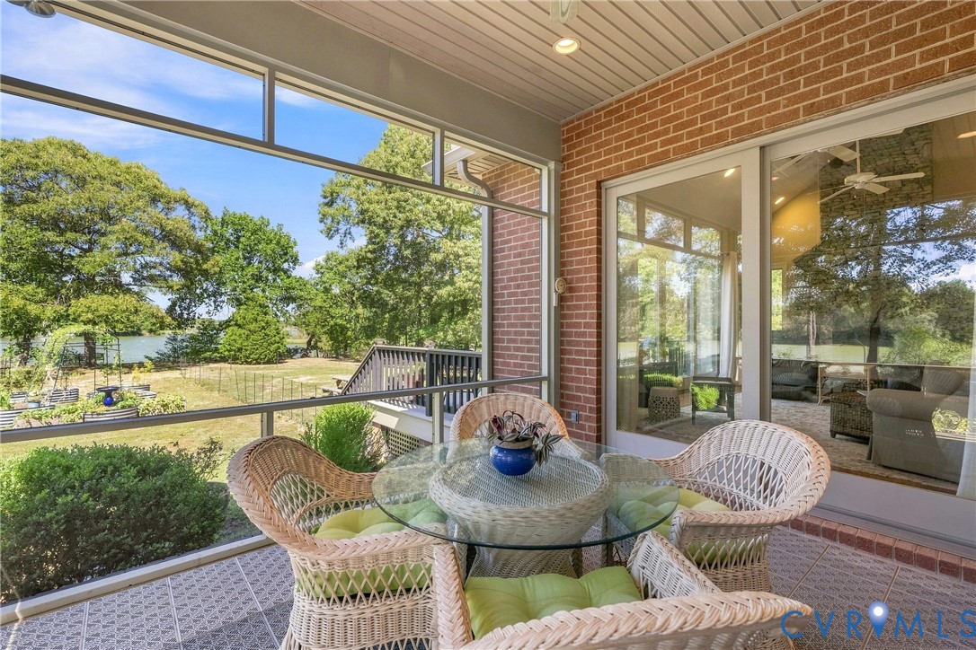 Screened patio with brick wall and sliding glass door
