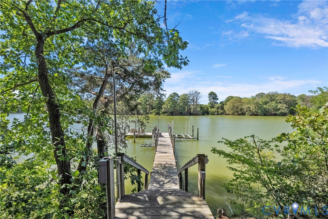 Waterfront access with a private wooden pier and boat slips