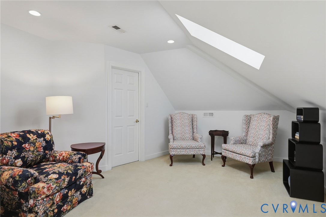 Sloped ceiling with an integrated skylight and recessed lighting