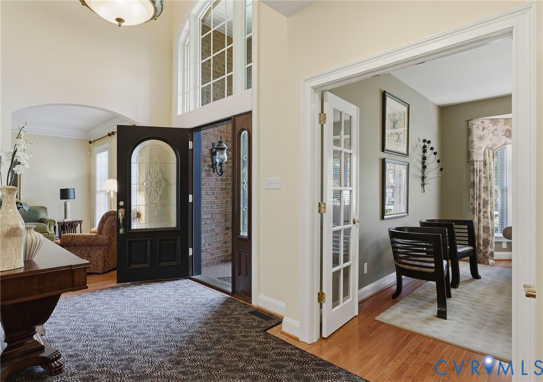 Two-story foyer with transom and arched windows Two-story foyer with transom and arched windows