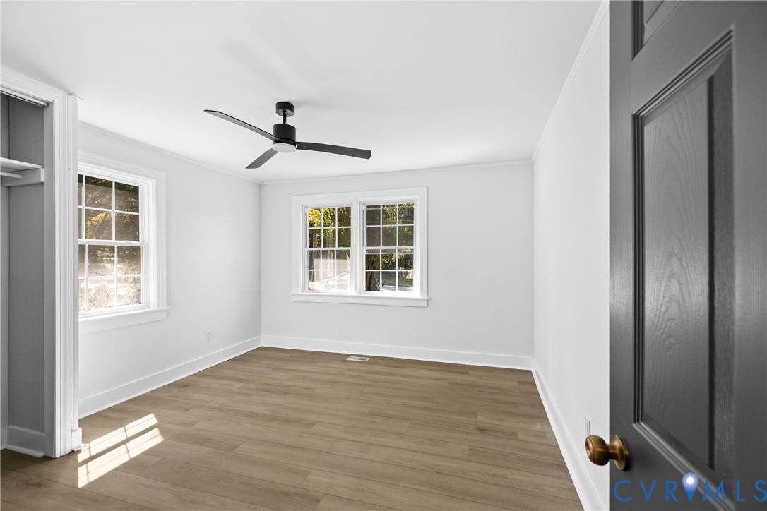 Clean white walls with wood-finish flooring