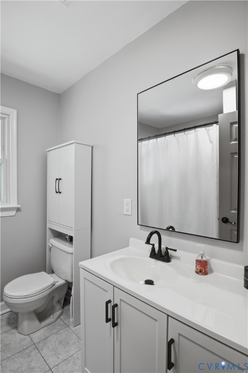 2ND FLR BTHROOM Vanity with integrated sink, black-finish faucet, and a large rectangular mirror