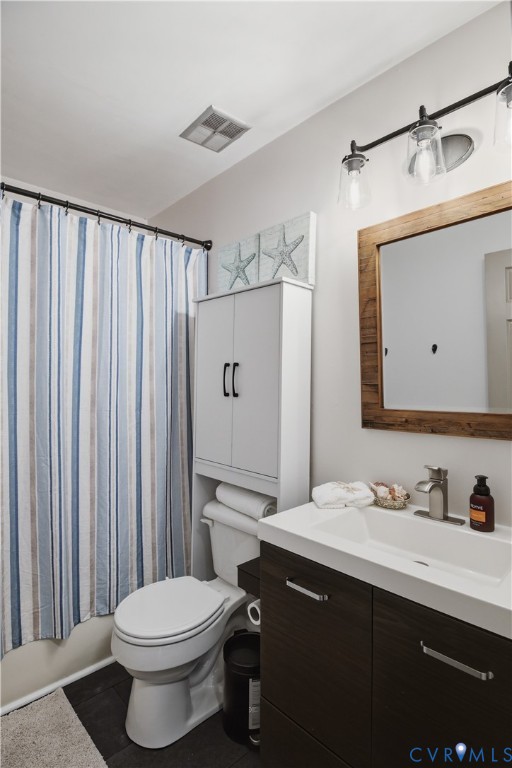Modern vanity with a rectangular basin sink, contemporary faucet, and dark wood-finish cabinetry