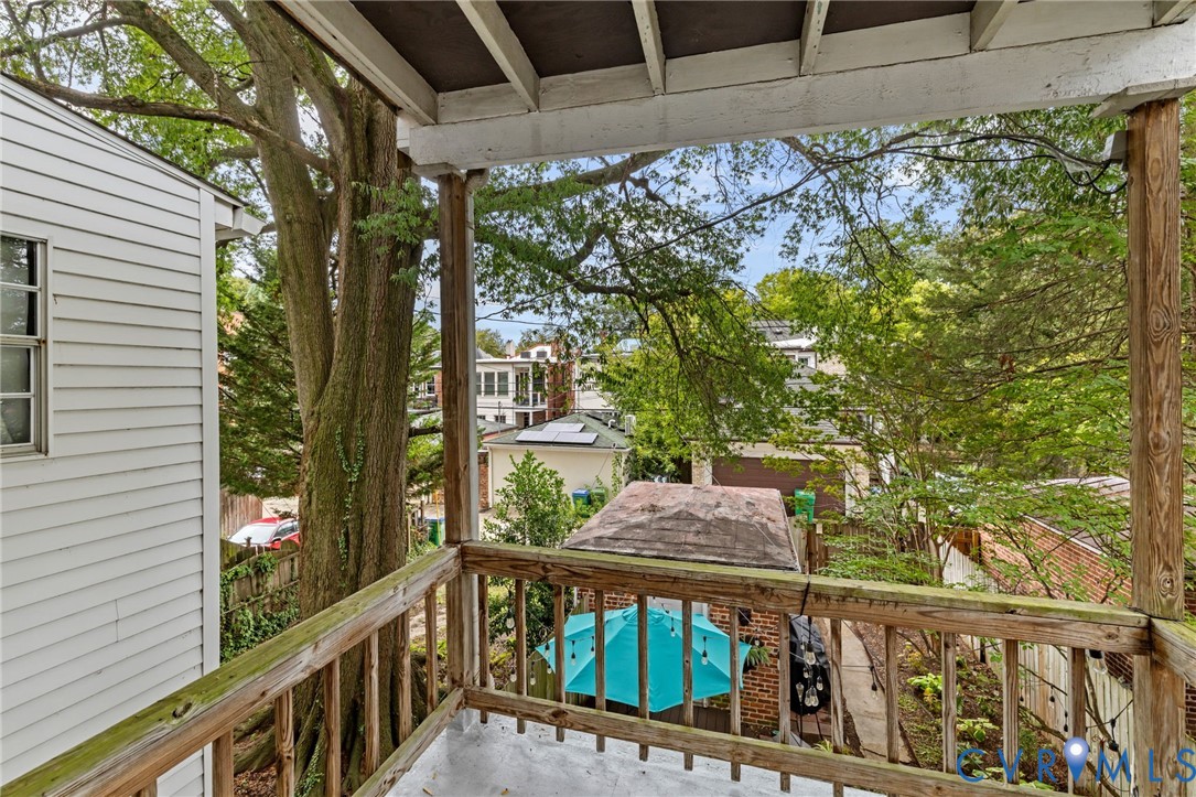 Upper-level balcony with wood railing