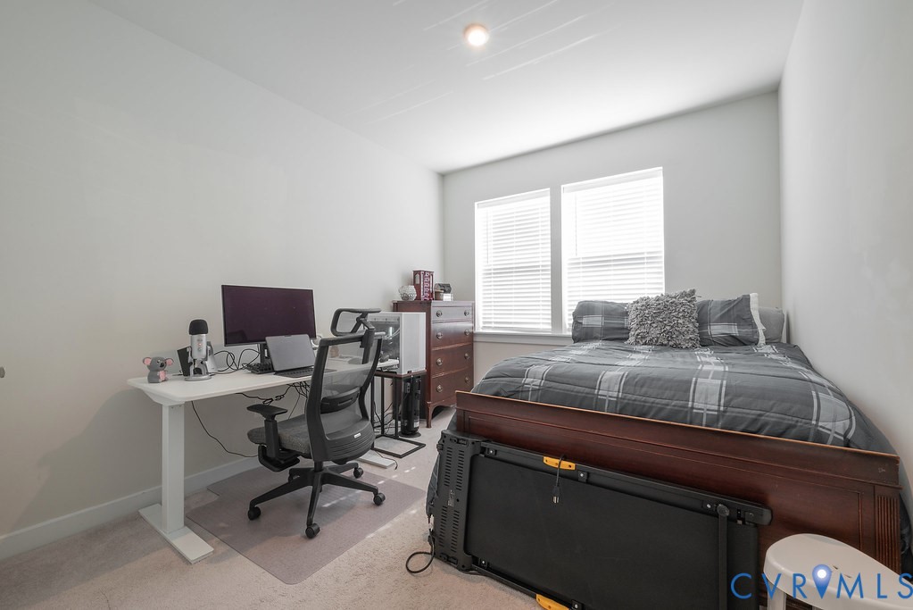 Neutral wall finishes, recessed lighting, and dual windows with blinds
