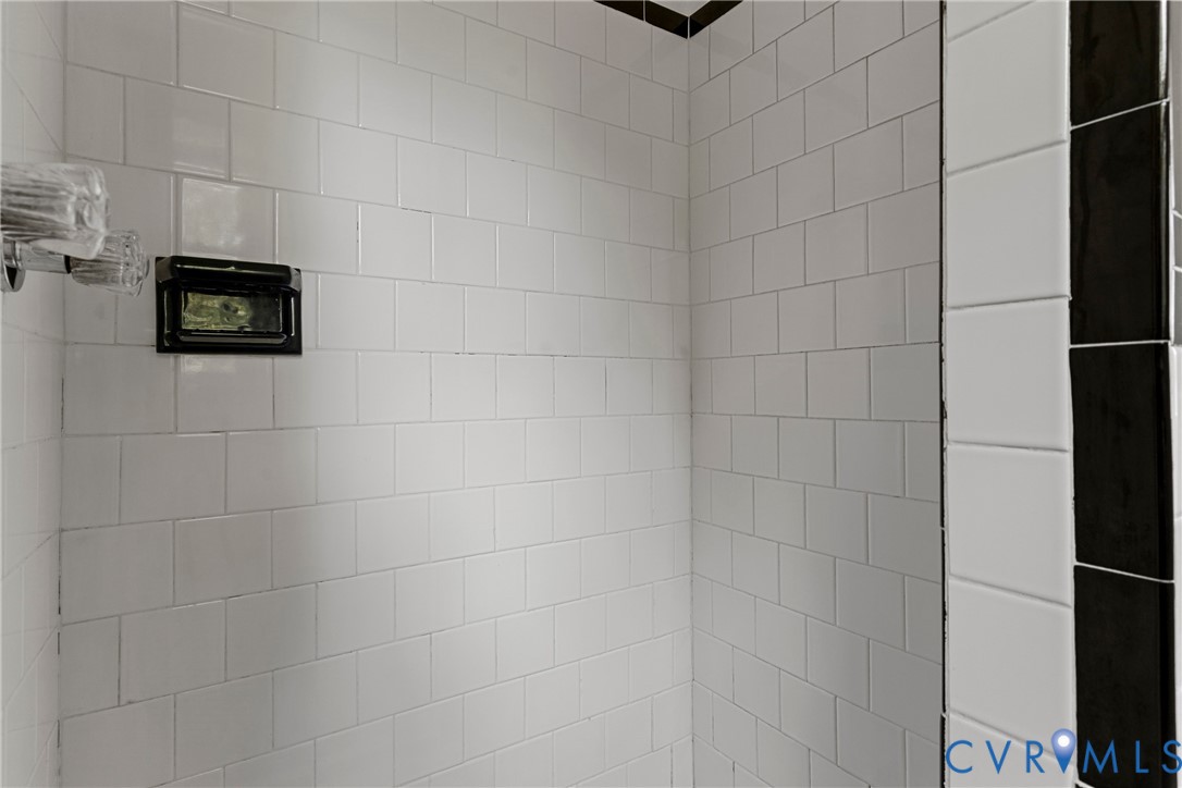 White subway tile walls with dark grout lines