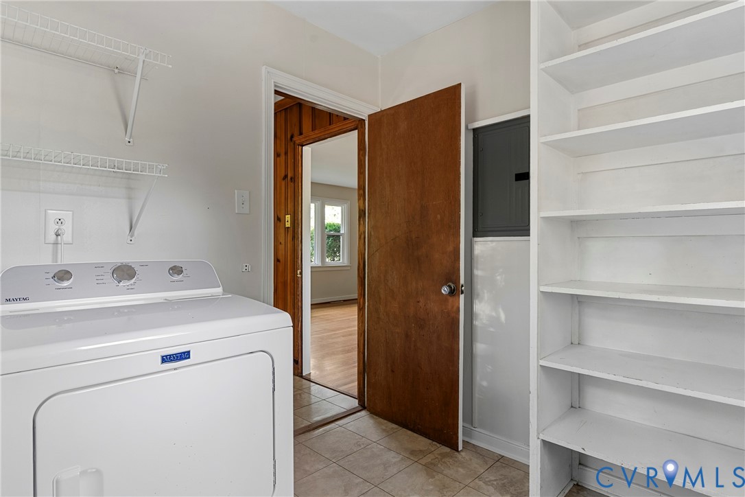 Tile flooring, built-in shelving, wire shelving, wood-paneled doorway, hardwood flooring