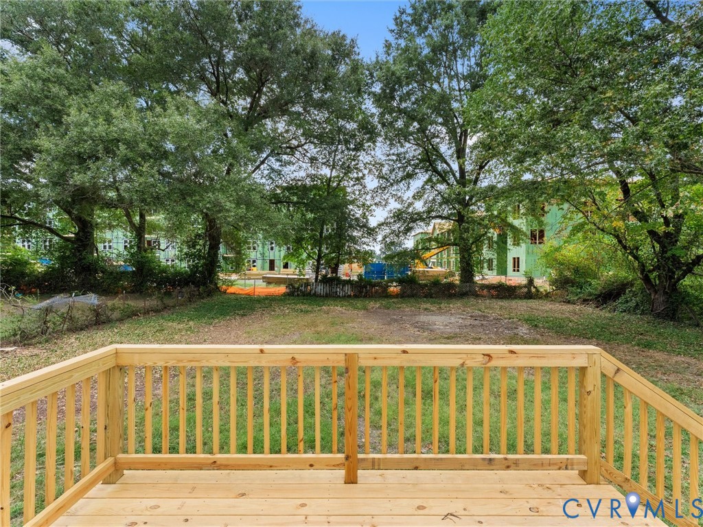 Wood deck with natural finish, featuring wood railings and steps Wood deck with natural finish, featuring wood railings and steps