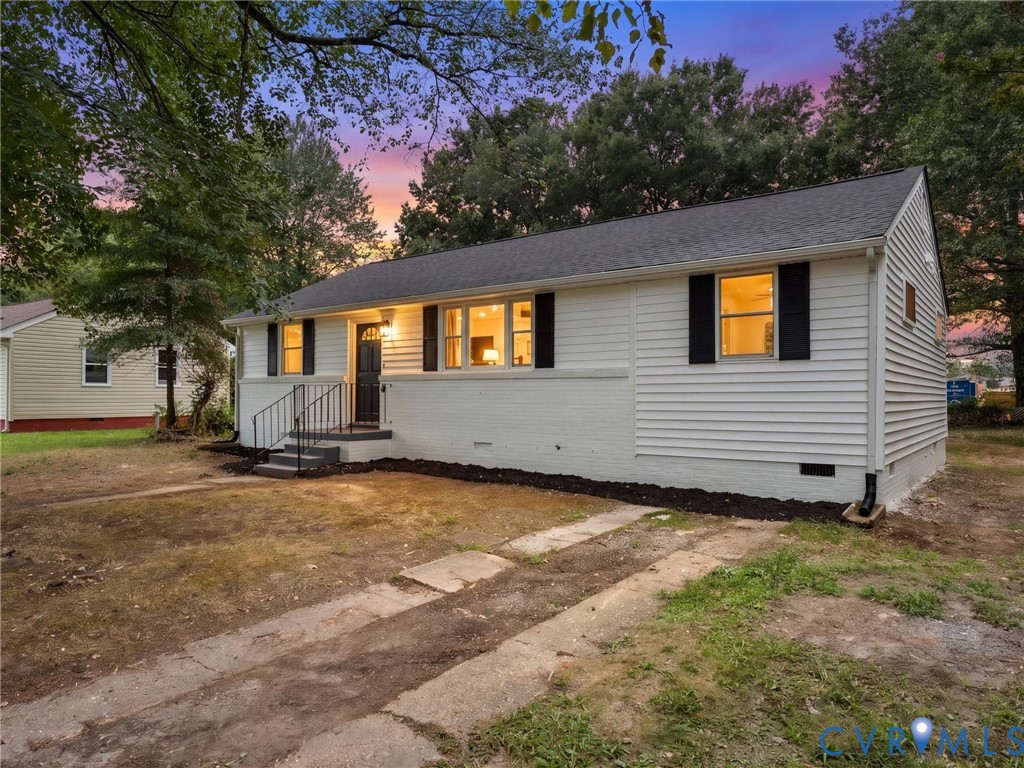 White siding exterior with a dark shingle roof White siding exterior with a dark shingle roof