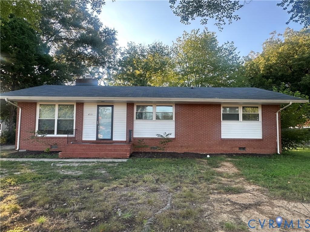 Brick exterior with white siding accents and dark shingle roofing Brick exterior with white siding accents and dark shingle roofing