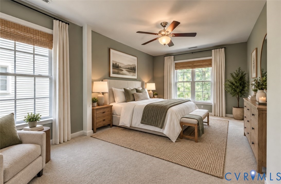Recessed lighting, ceiling fan with light fixture, multiple windows, and carpeted flooring