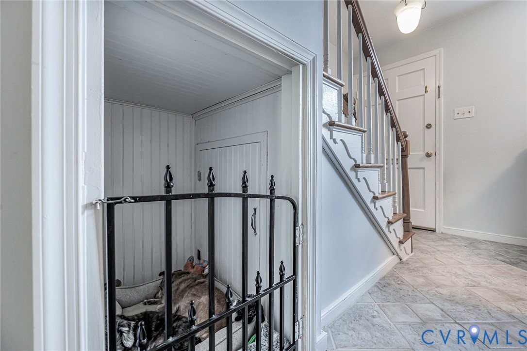Cozy pet space under the stairs and additional under stair storage. Such a great use of space