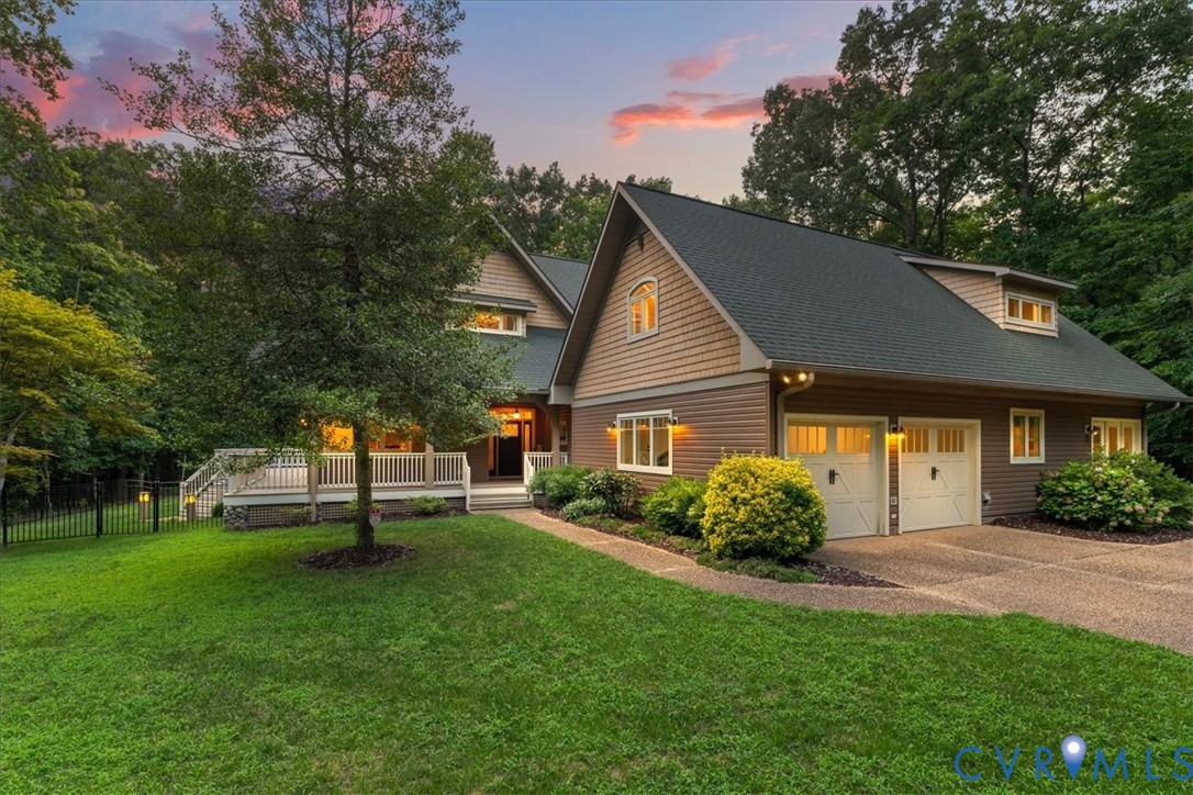 Multi-level exterior deck with a screened porch, lattice skirting, and stone column accents