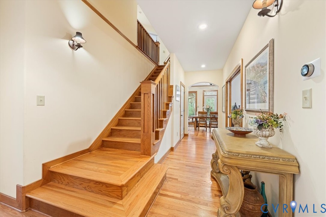 Hardwood flooring throughout the entry and staircase