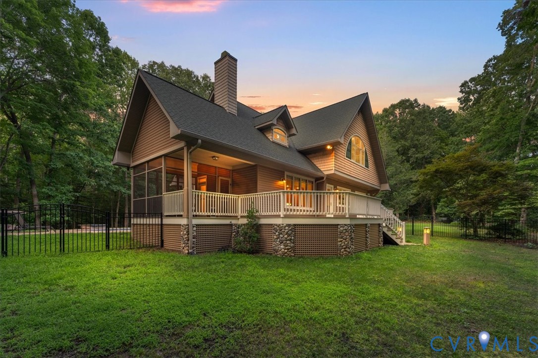 Wood siding exterior with a screened porch, open deck, and a stone features