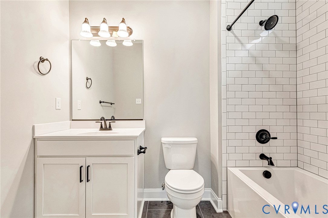 White subway tile shower surround with matte black fixtures