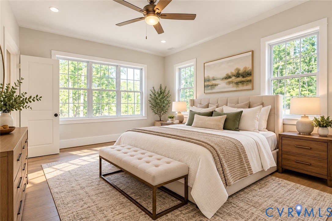 Recessed lighting, wood-finish flooring, ceiling fan, and multiple windows