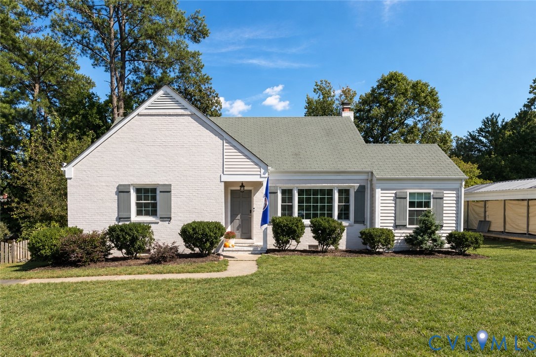 White brick exterior with gray shutters