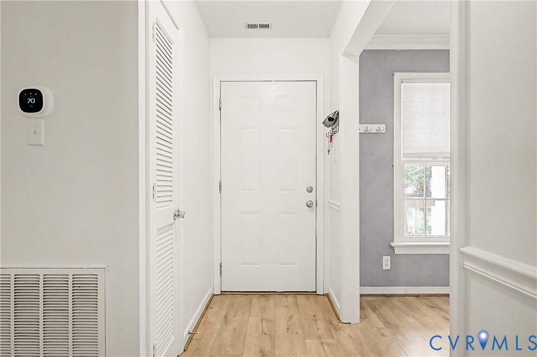 Wood-finish flooring throughout the entry