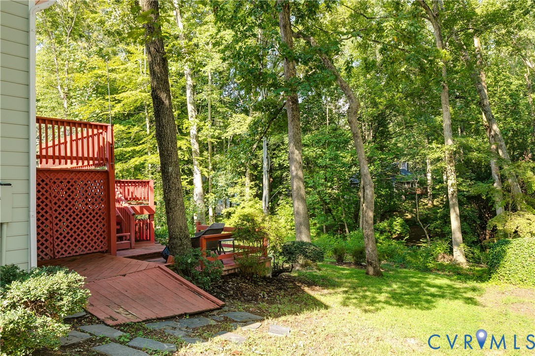 Multi-level red-stained deck with lattice accents