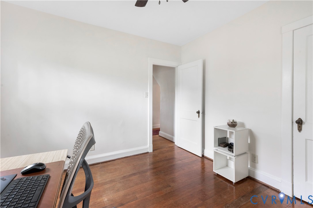 Hardwood flooring, white walls, white trim, and a ceiling fan Hardwood flooring, white walls, white trim, and a ceiling fan