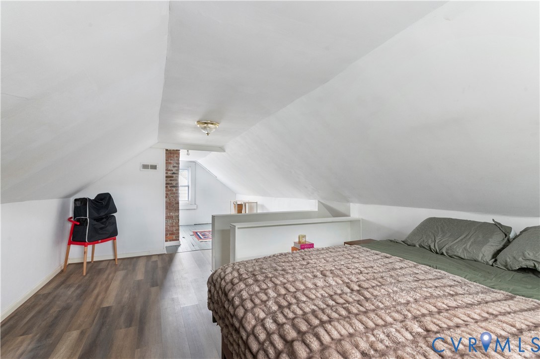 Sloped ceilings with exposed brick architectural details