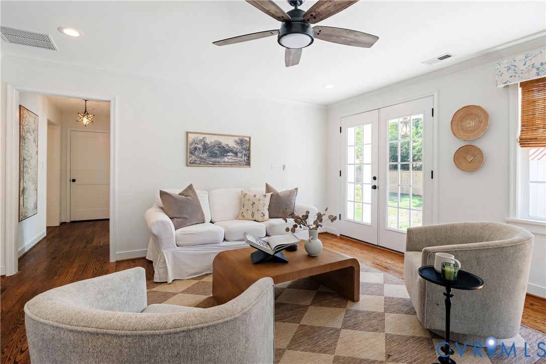 Hardwood flooring, recessed lighting, and a ceiling fan with light fixture