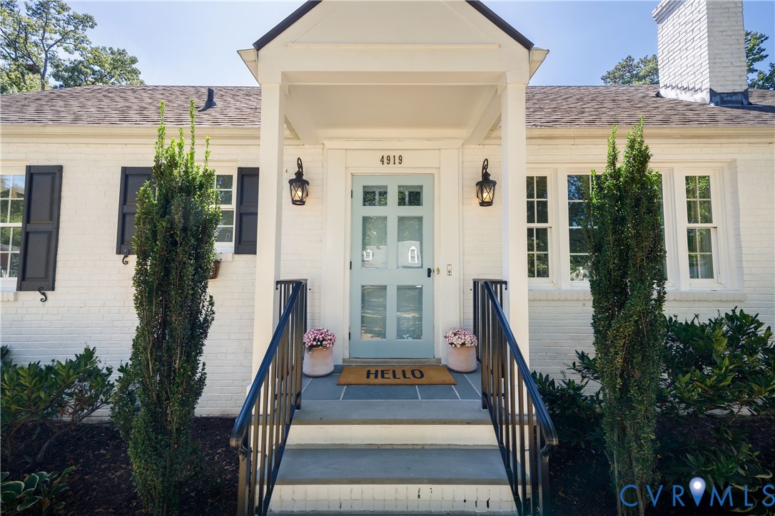 White brick exterior with black shutters