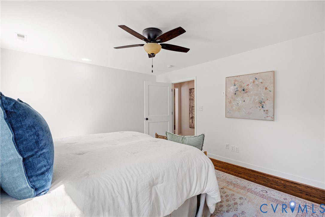 Hardwood flooring, recessed lighting, and a ceiling fan with integrated lighting