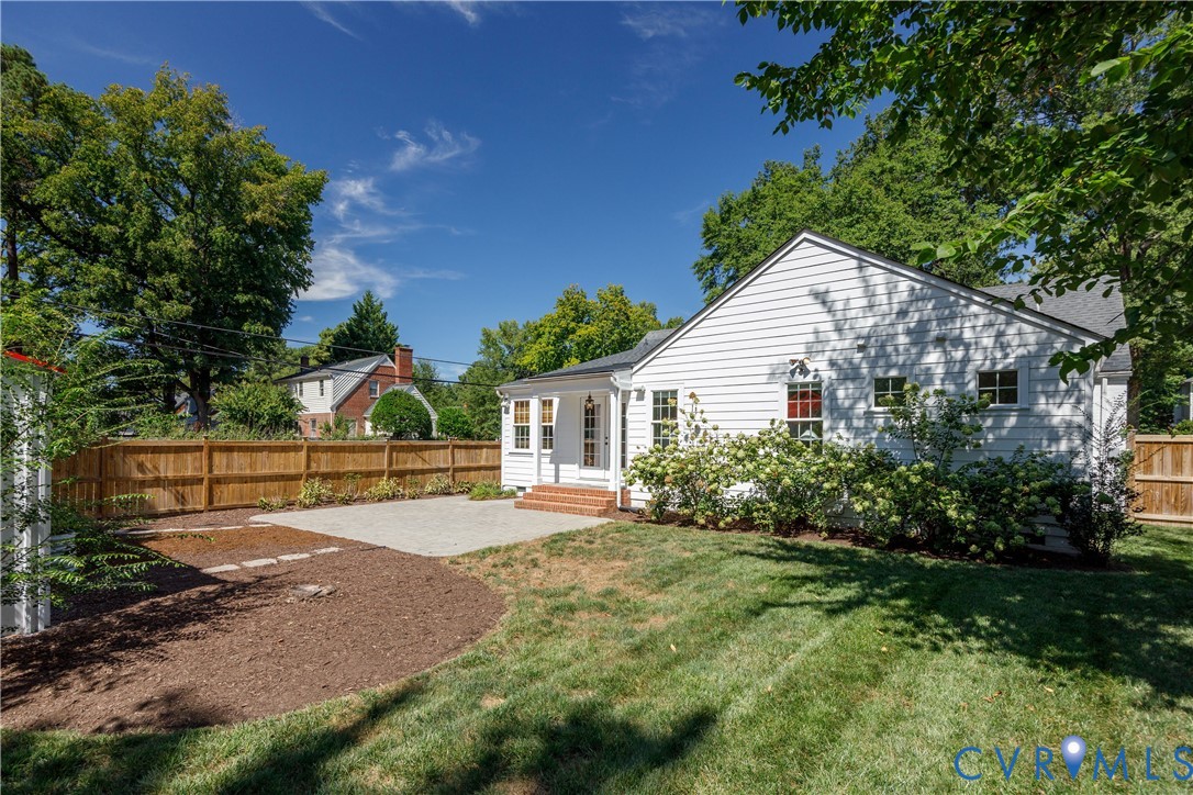 White siding exterior with a dark shingle roof
