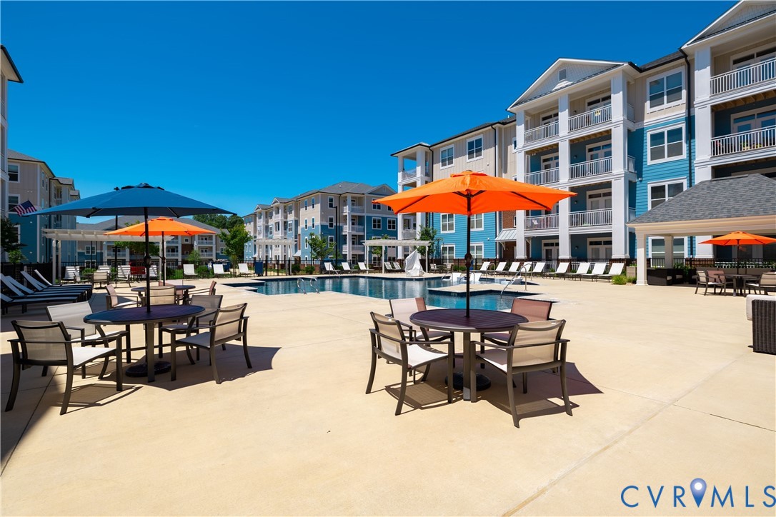 Resort-style pool with integrated spa and ample surrounding hardscaping Resort-style pool with integrated spa and ample surrounding hardscaping