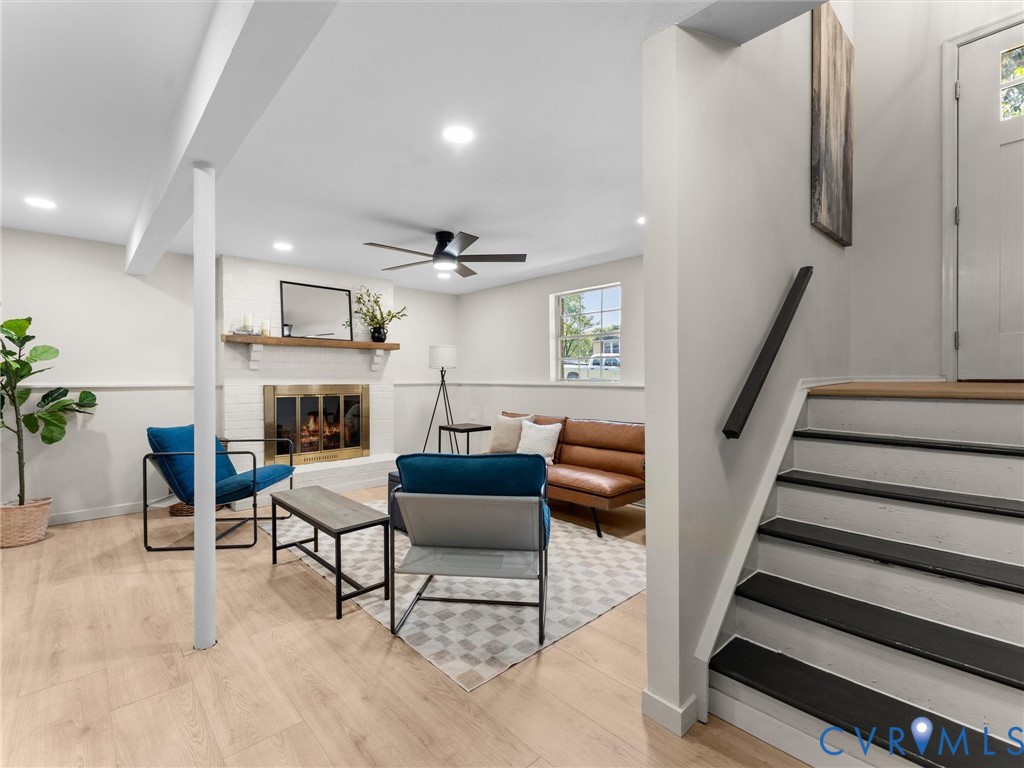 Recessed lighting, wood-finish flooring, and a ceiling fan