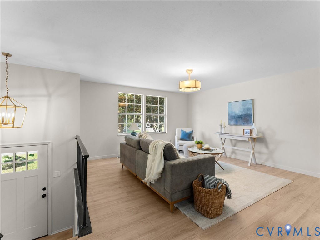 Light wood-finish flooring with white walls