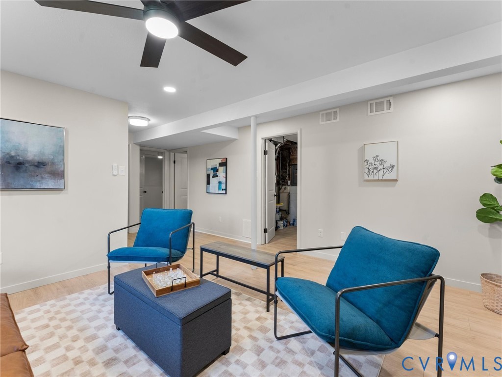 Recessed ceiling lighting, wood-finish flooring, ceiling fan with integrated lighting, white interior doors